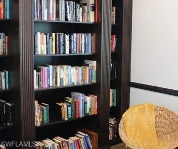 a view of staircase with white walls and a window