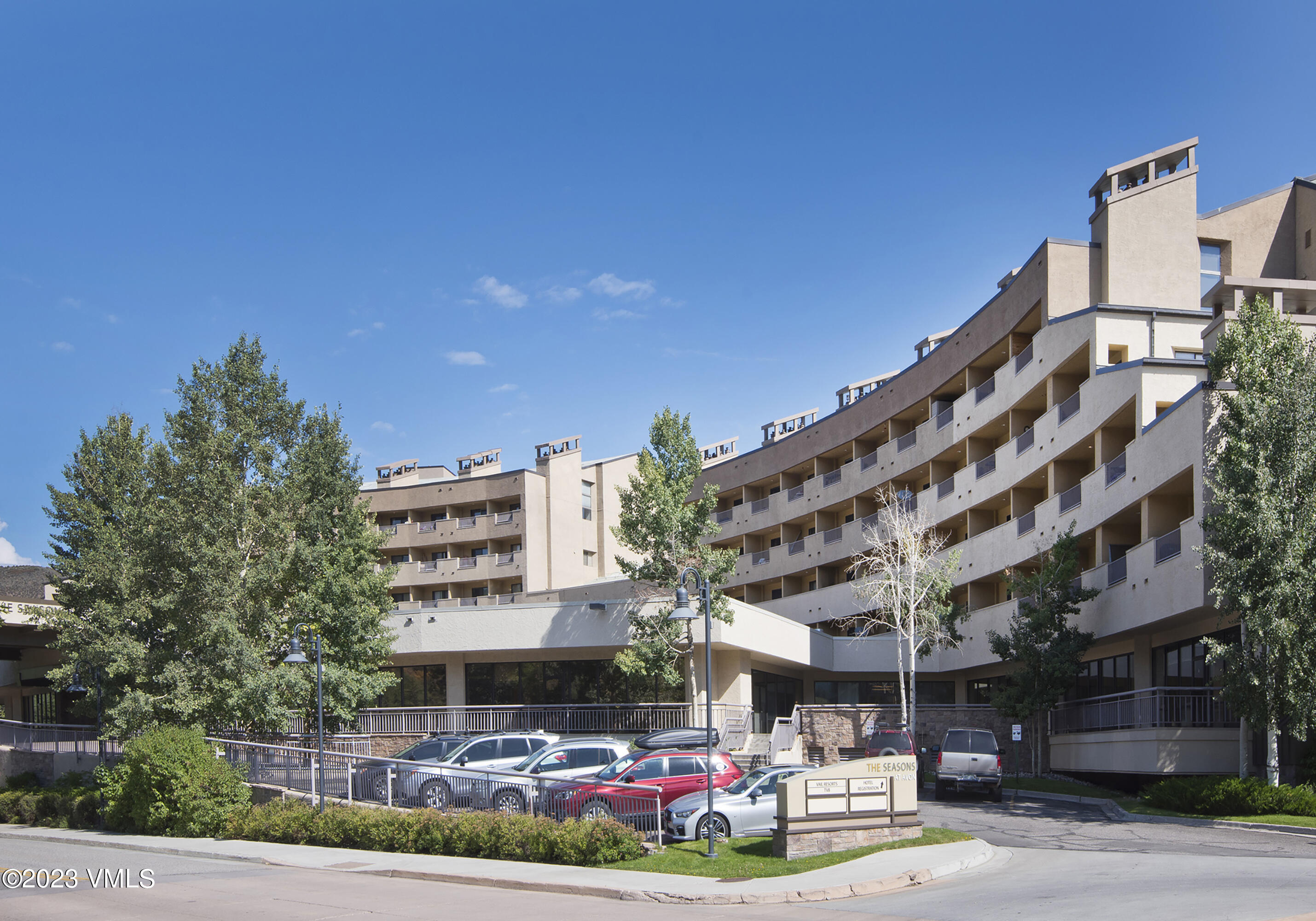 137 Benchmark Road, Unit 327 Avon, CO 81620 - Photo 36 of 43 a building view with swimming pool and glass windows