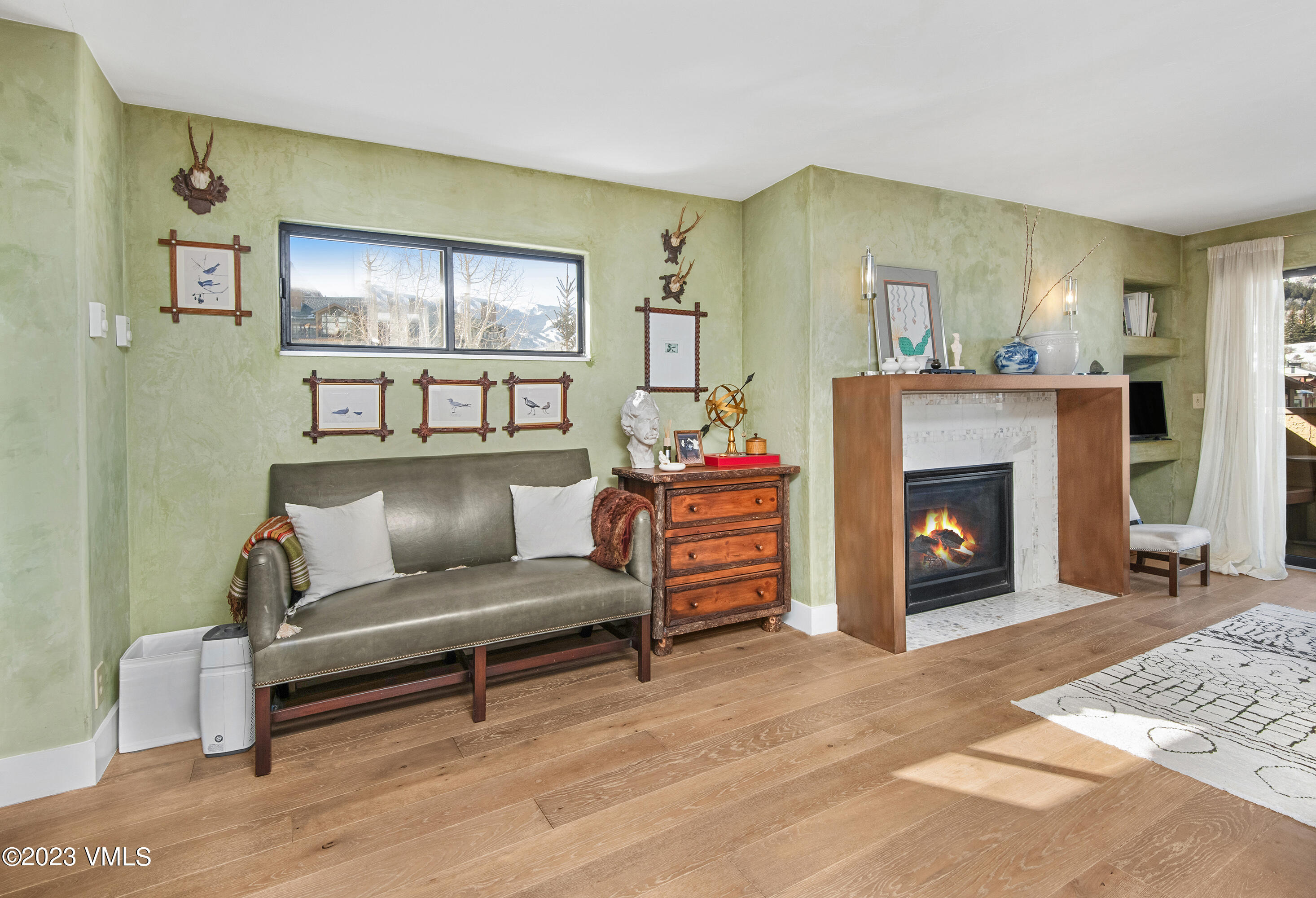 137 Benchmark Road, Unit 327 Avon, CO 81620 - Photo 4 of 43 a living room with furniture and a fireplace