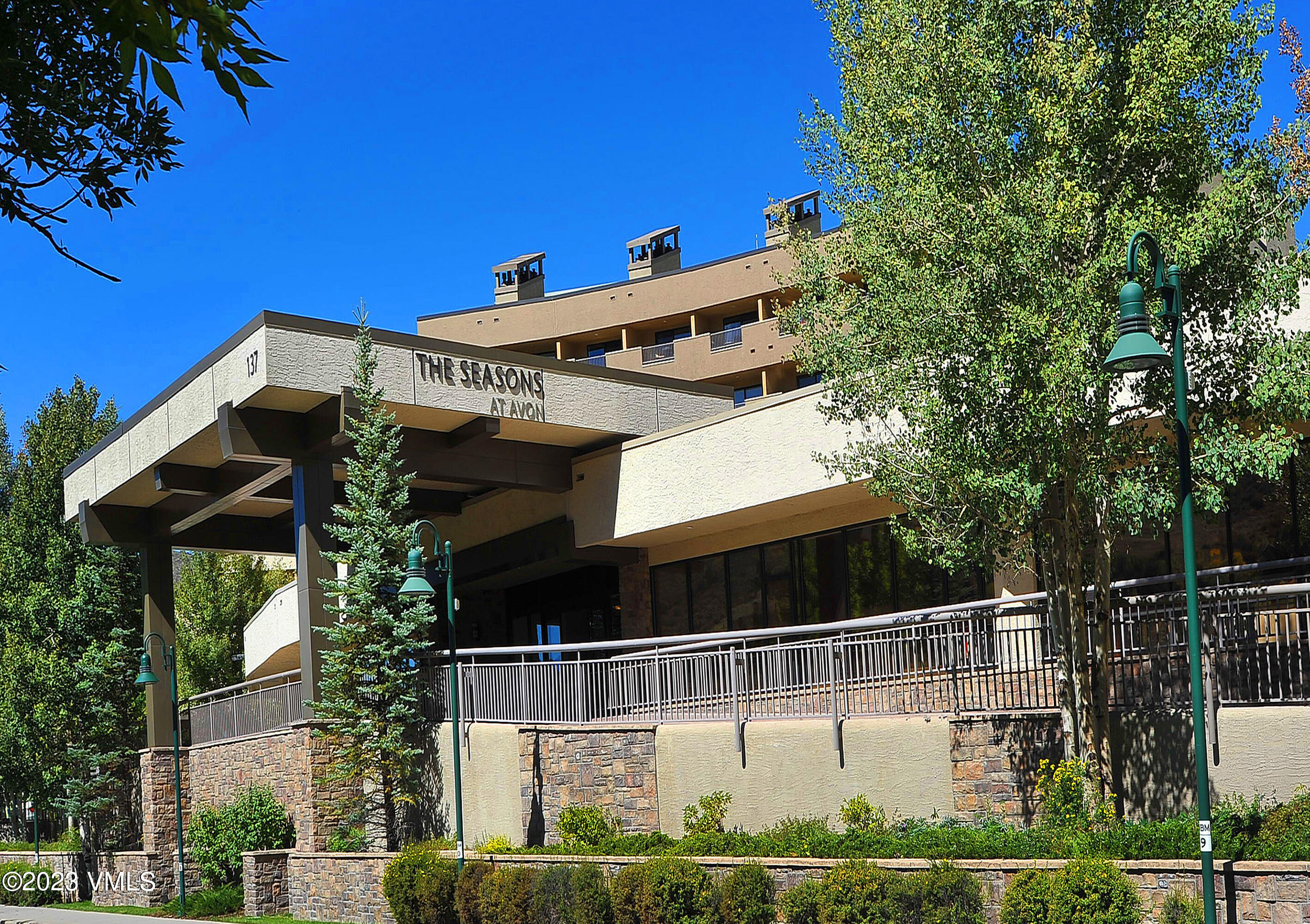137 Benchmark Road, Unit 327 Avon, CO 81620 - Photo 41 of 43 a front view of a house with a yard