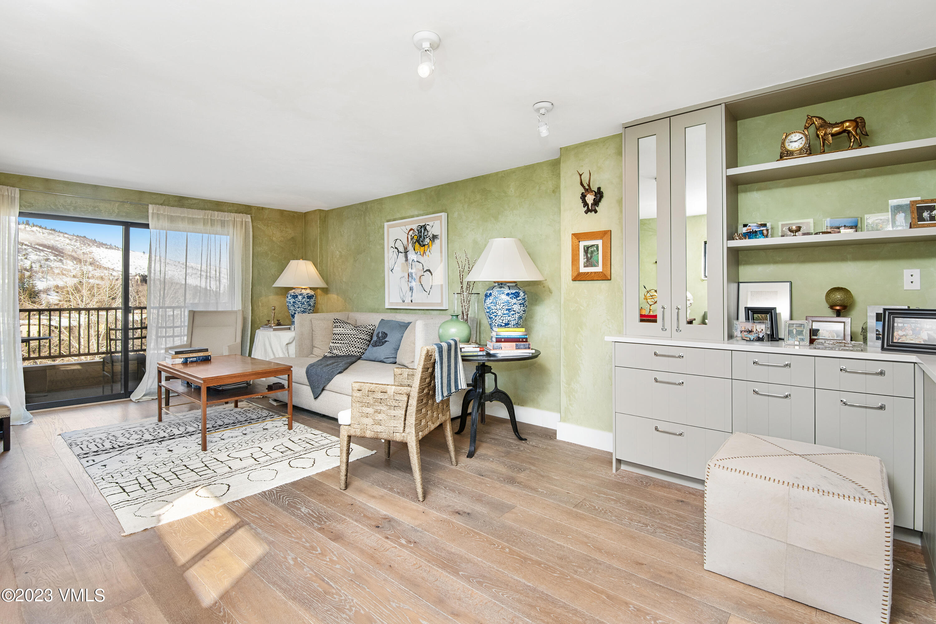 137 Benchmark Road, Unit 327 Avon, CO 81620 - Photo 5 of 43 a living room with furniture and a table