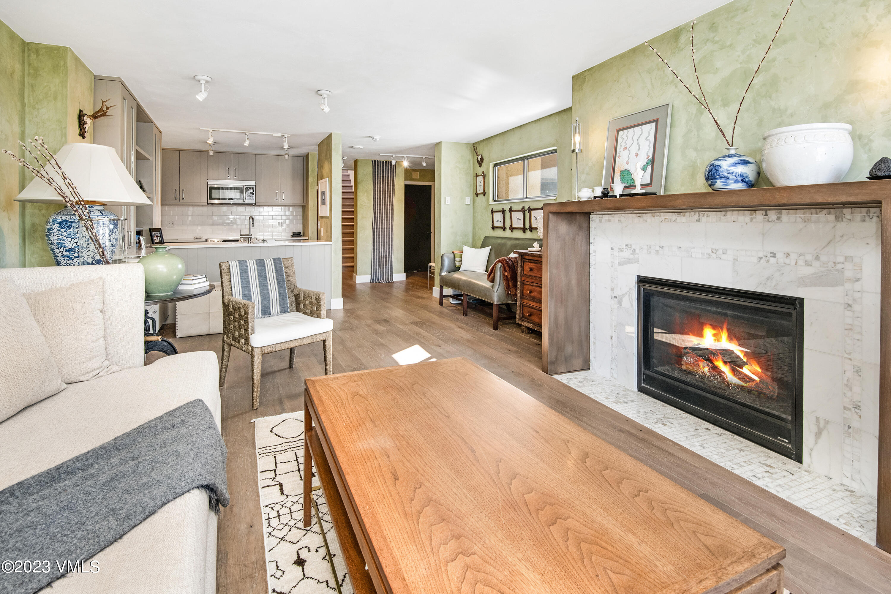 137 Benchmark Road, Unit 327 Avon, CO 81620 - Photo 8 of 43 a living room with furniture a fireplace and a fireplace