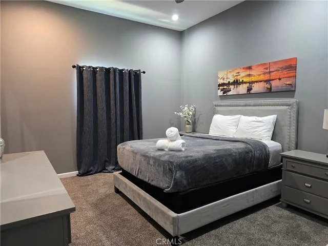 a white toilet sitting next to a bath tub