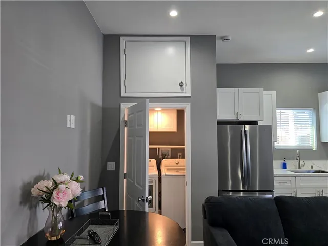 a kitchen with a sink and a stove top oven