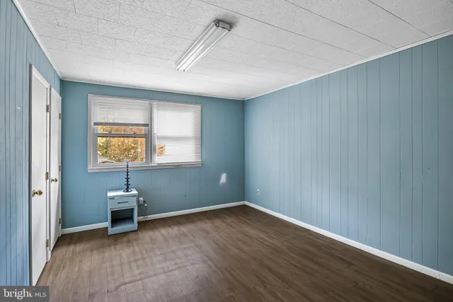 a bathroom with a sink a mirror and shower
