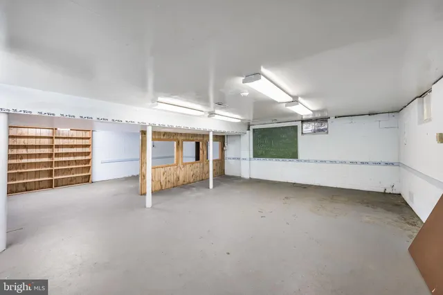 a kitchen with granite countertop a sink and a stove