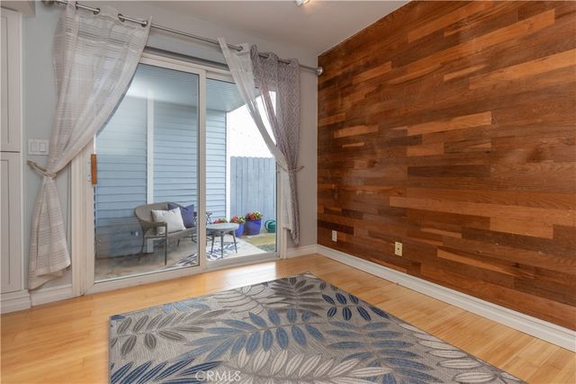 a bathroom with a bathtub and next to a window