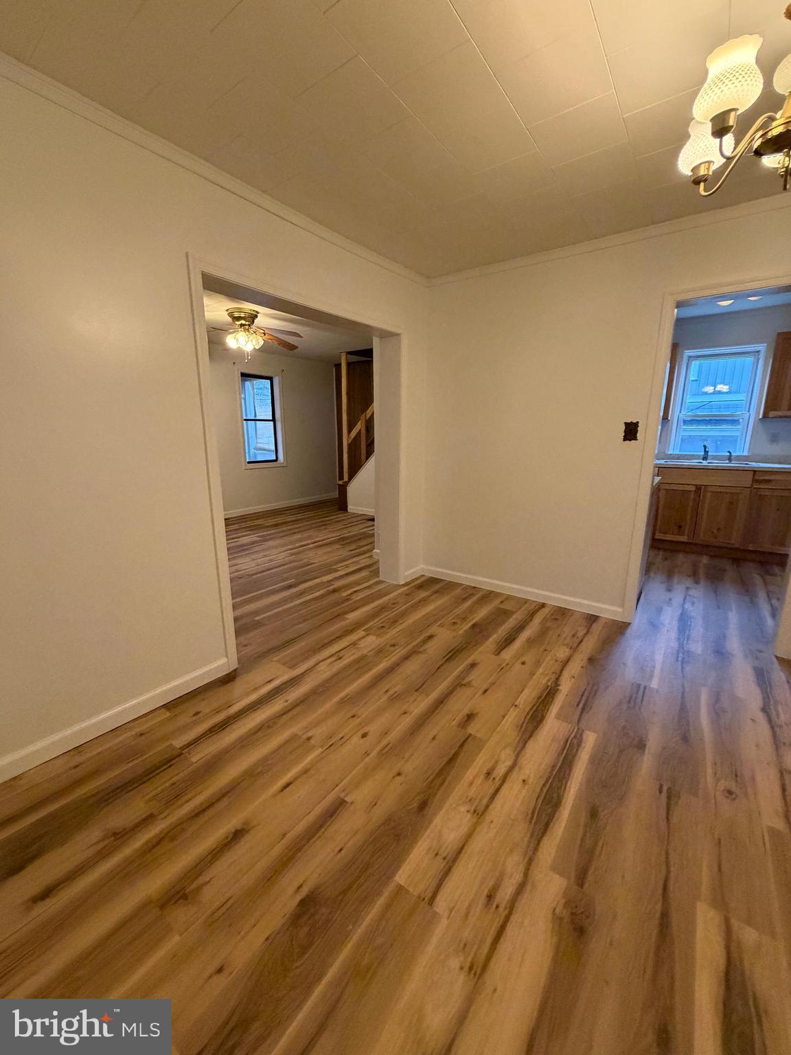 488 State Street Sandy Ridge, PA 16677 - Photo 13 of 36 a view of a room with wooden floor and a sink