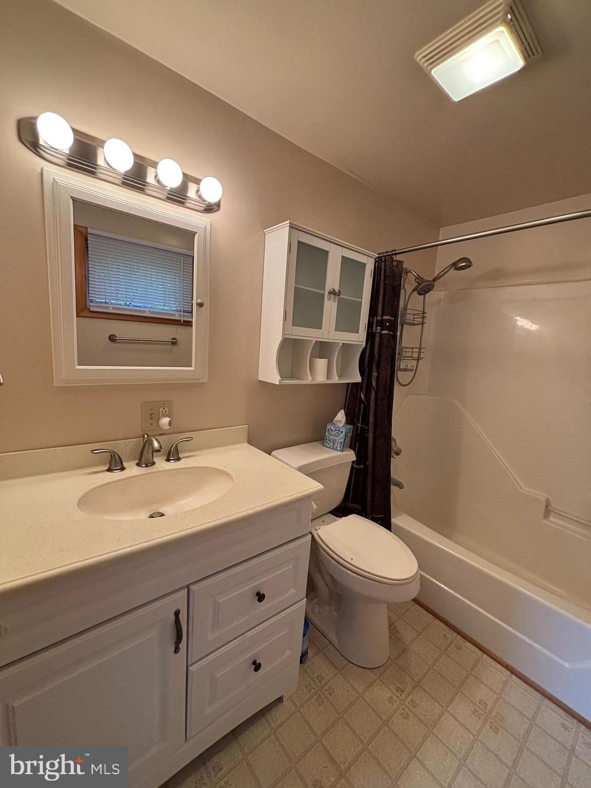 488 State Street Sandy Ridge, PA 16677 - Photo 20 of 36 a bathroom with a double vanity sink mirror and toilet