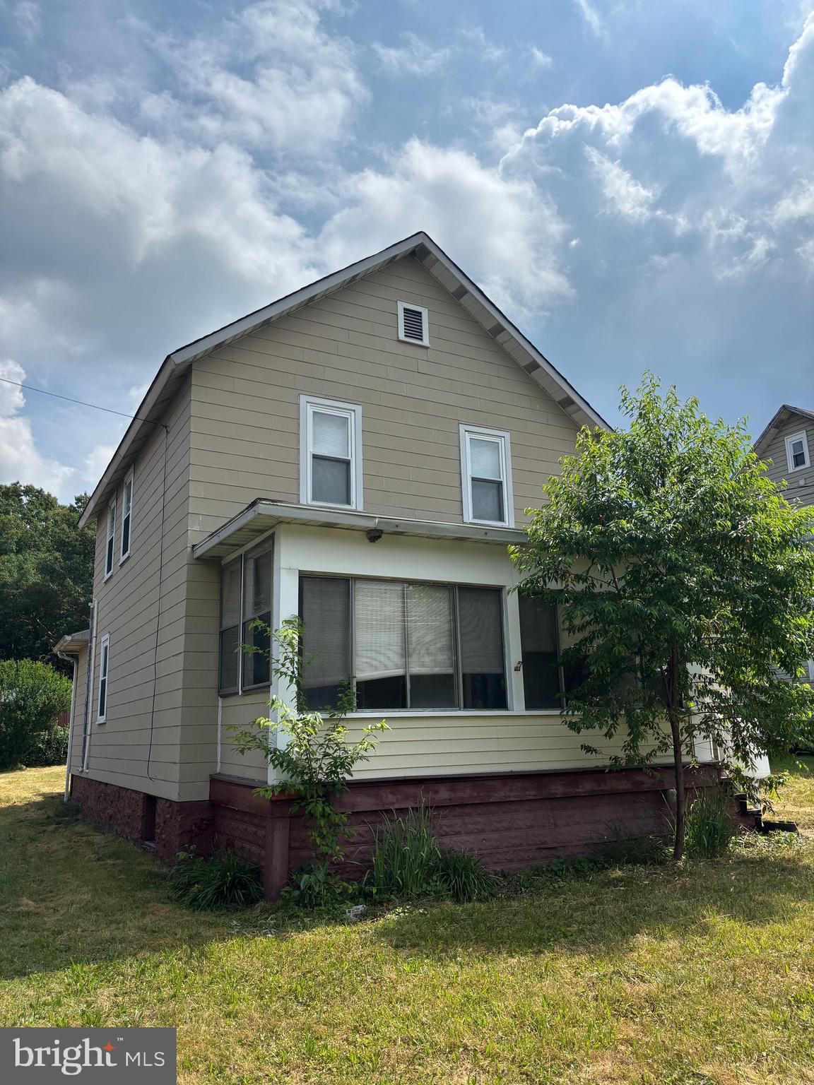 488 State Street Sandy Ridge, PA 16677 - Photo 2 of 36 a front view of a house with a yard