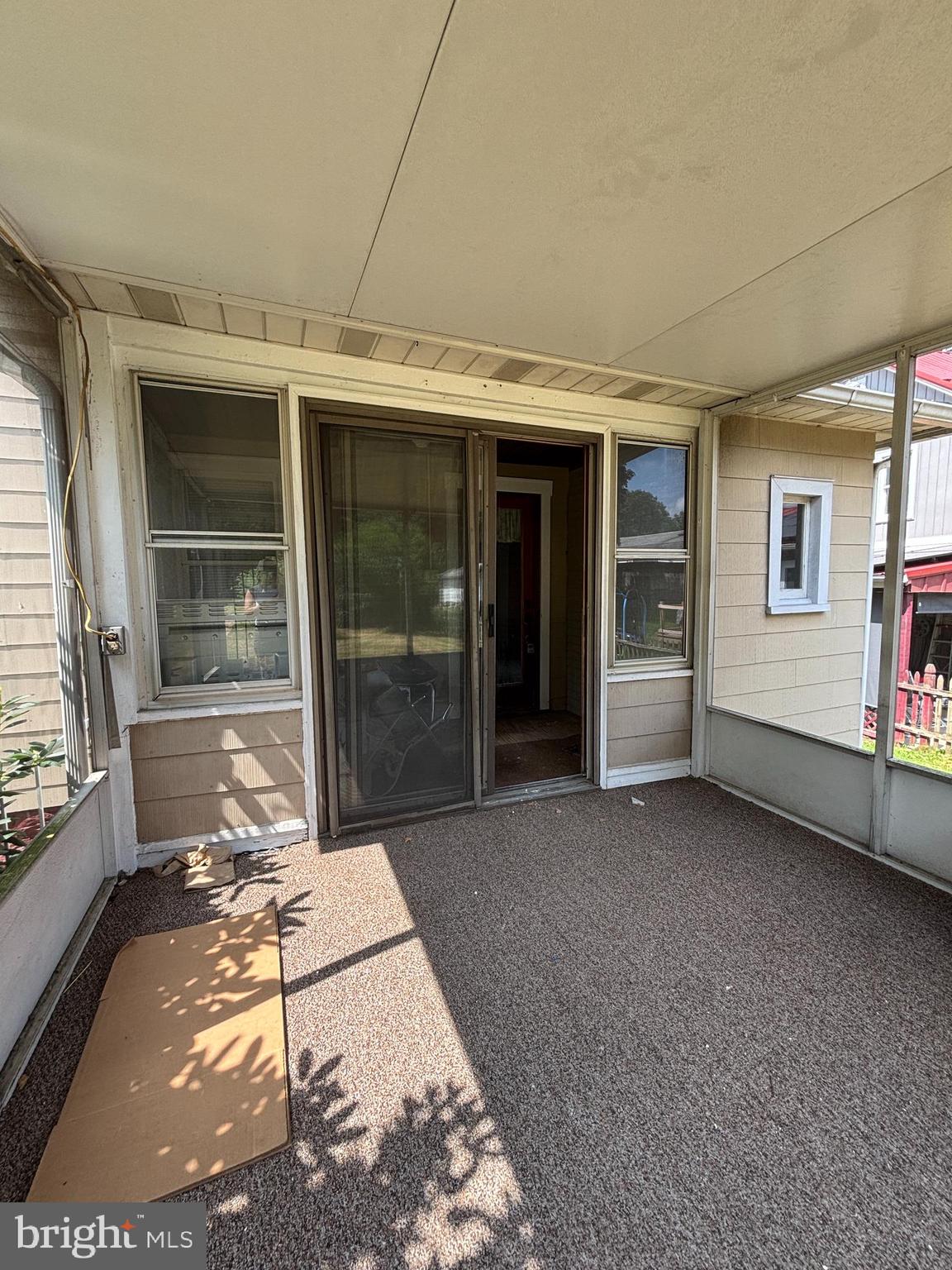 488 State Street Sandy Ridge, PA 16677 - Photo 30 of 36 a view of a porch with a table and chairs