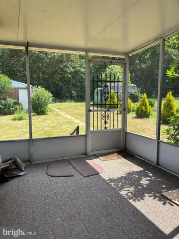 a view of a swimming pool with an outdoor seating