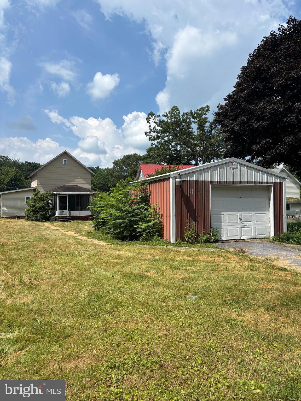 488 State Street Sandy Ridge, PA 16677 - Photo 36 of 36 a front view of house with yard and trees in the background
