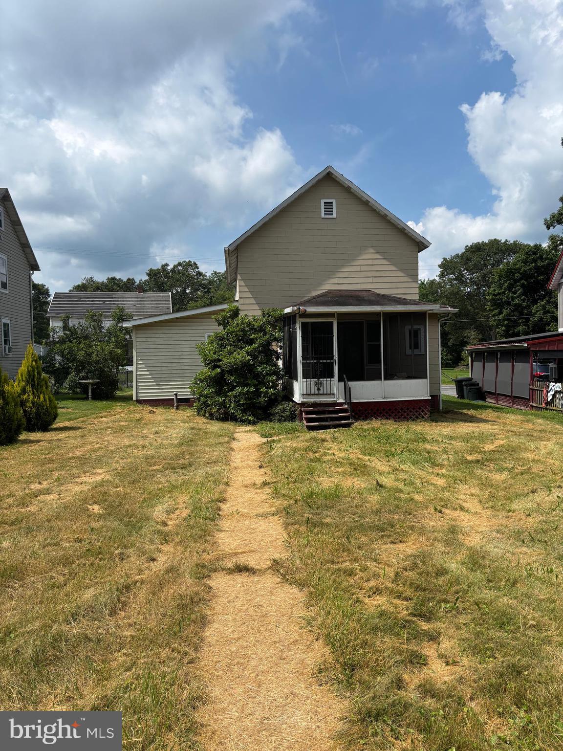 488 State Street Sandy Ridge, PA 16677 - Photo 4 of 36 a front view of house with swimming pool and green space