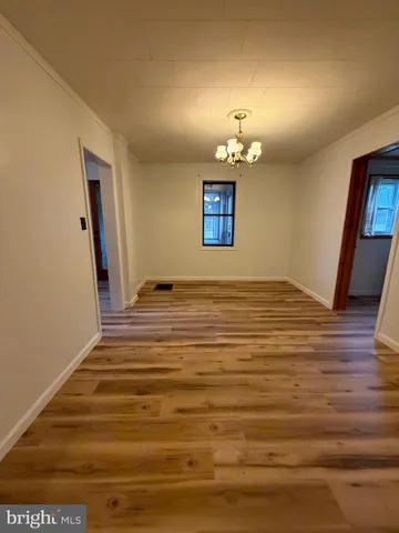 a view of a livingroom with wooden floor