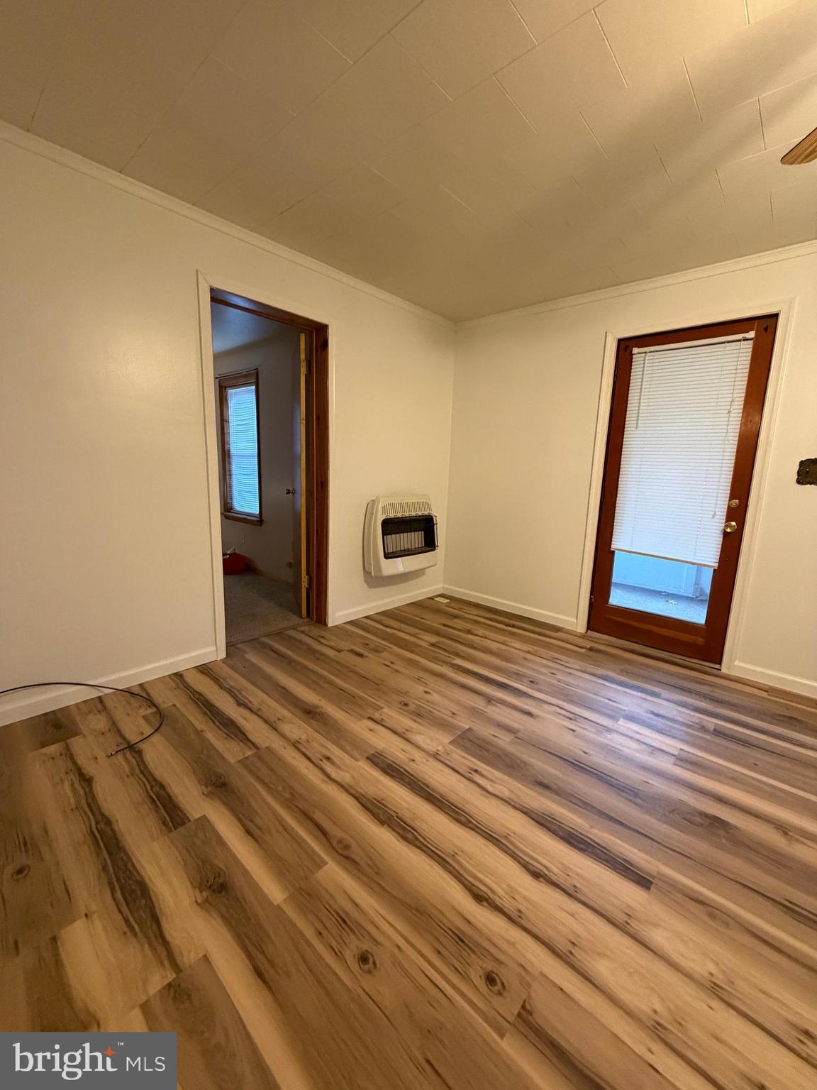 488 State Street Sandy Ridge, PA 16677 - Photo 9 of 36 a view of empty room with wooden floor