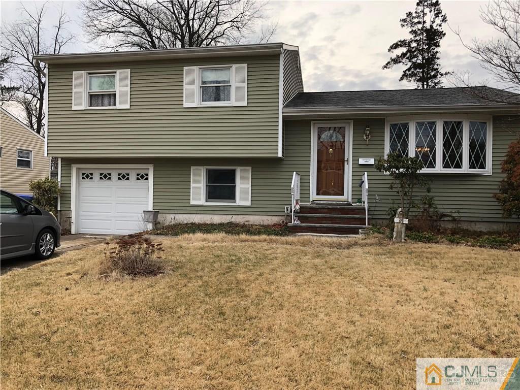 24 Baldwin Road Edison, NJ 08817 - Photo 1 of 1 a front view of a house with a yard