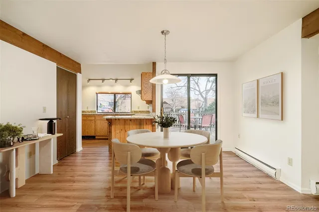 a dining room with furniture window wooden floor