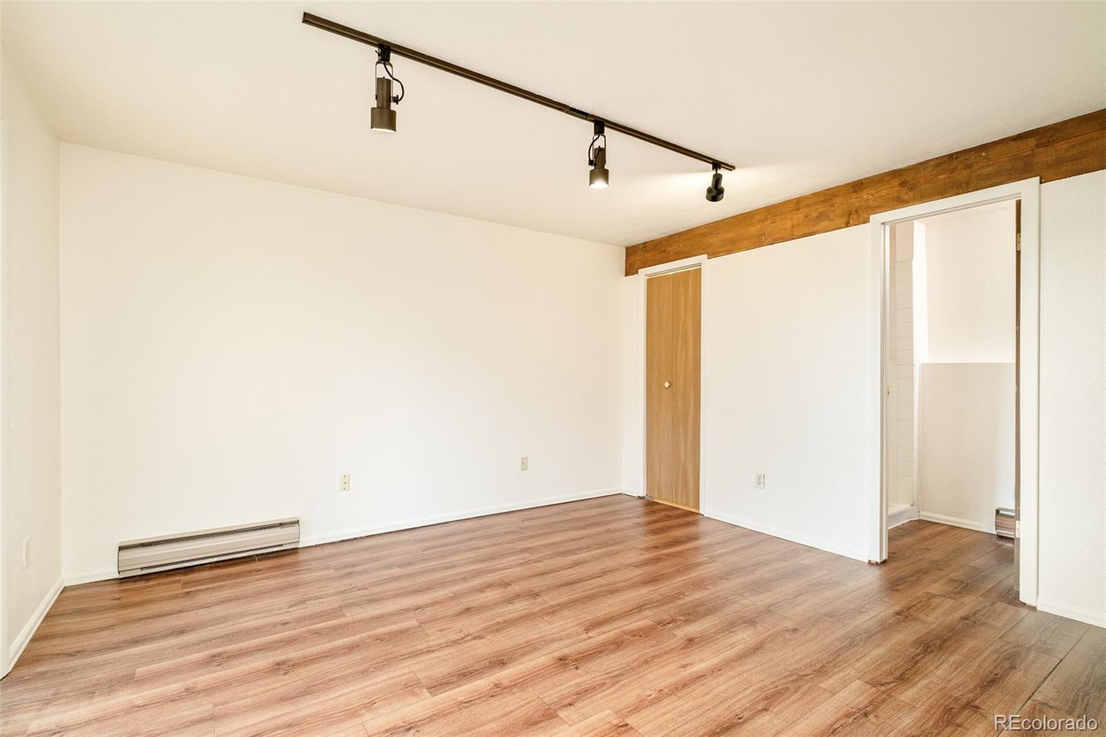 3760 Smuggler Place Boulder, CO 80305 - Photo 16 of 40 a view of a room with wooden floor and white walls