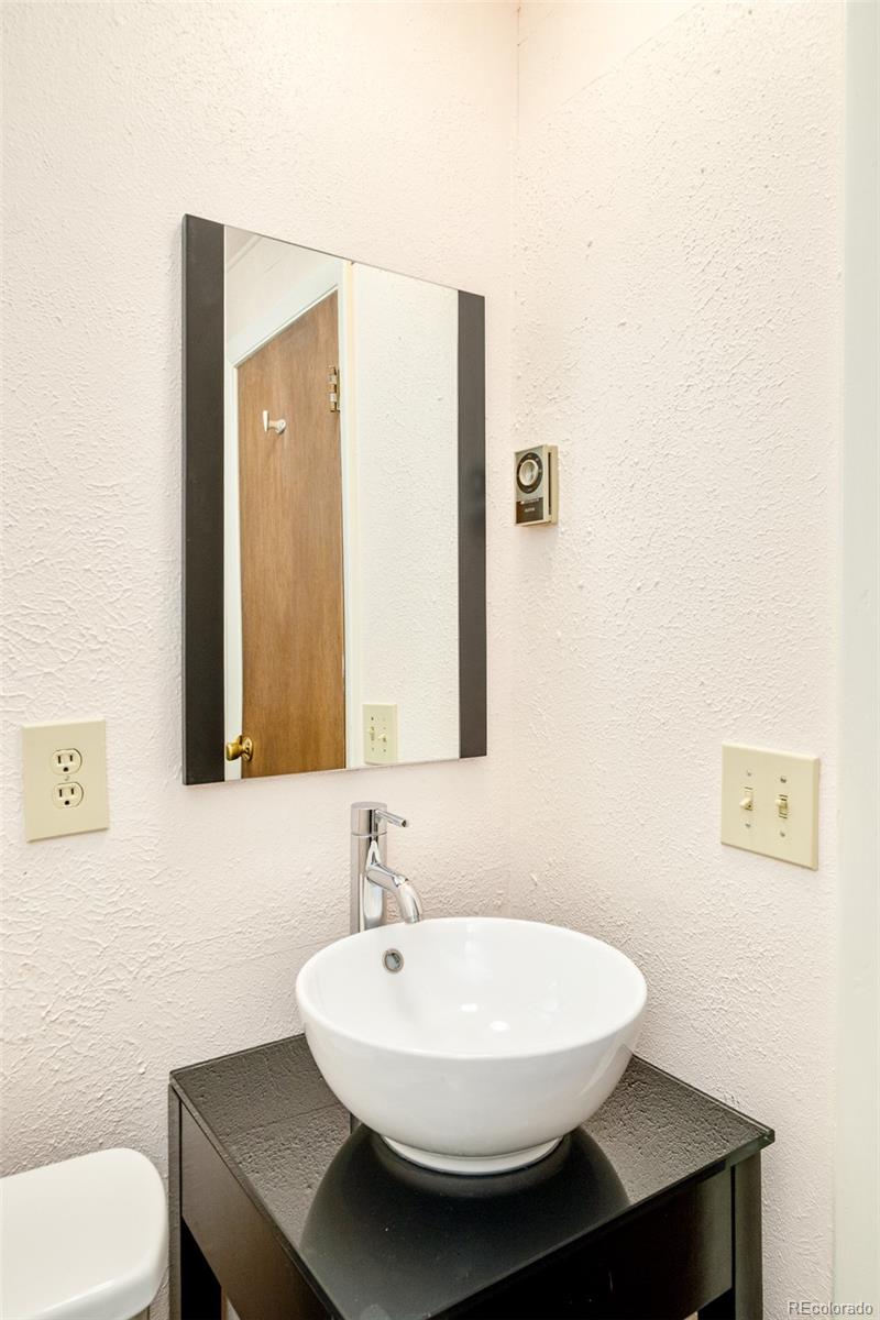 3760 Smuggler Place Boulder, CO 80305 - Photo 17 of 40 a bathroom with a sink and a toilet
