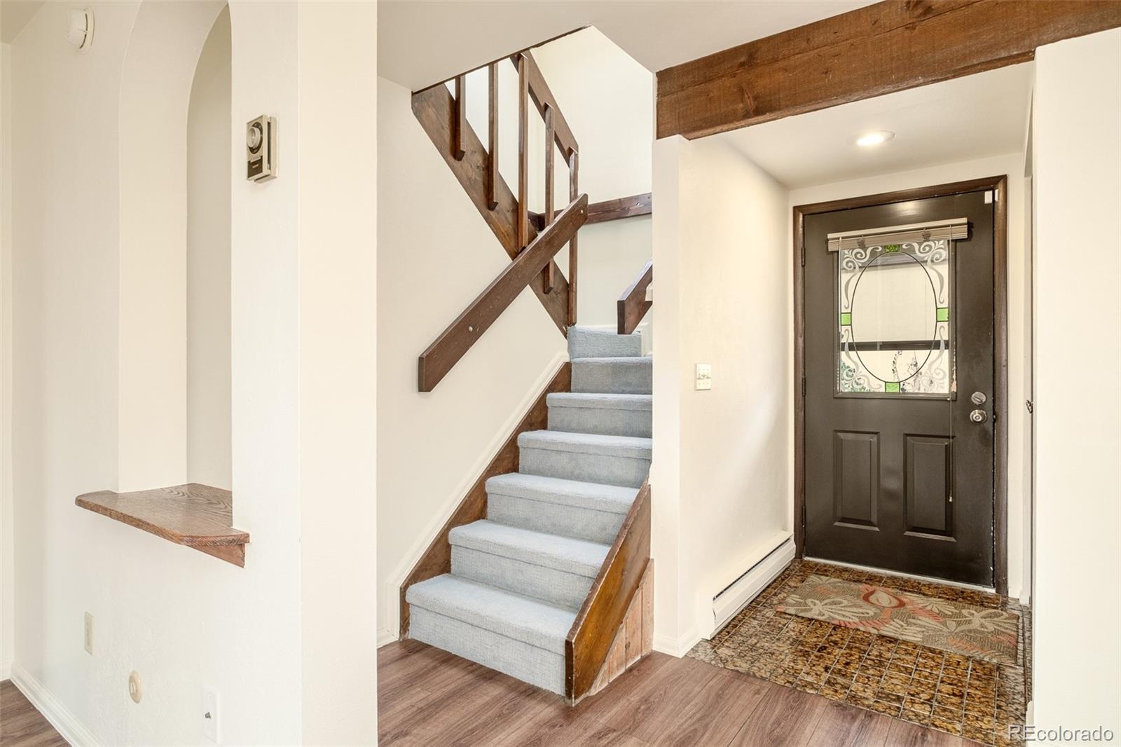3760 Smuggler Place Boulder, CO 80305 - Photo 19 of 40 a view of entryway and hall with wooden floor