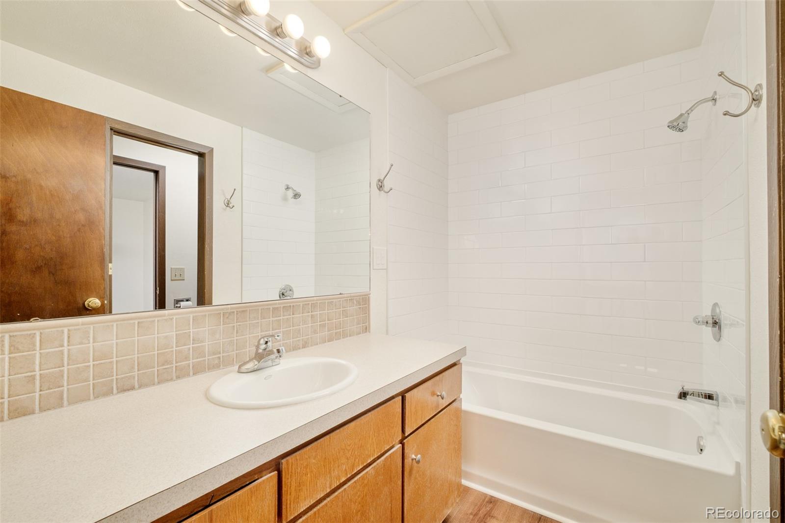 3760 Smuggler Place Boulder, CO 80305 - Photo 24 of 40 a bathroom with a sink and a mirror