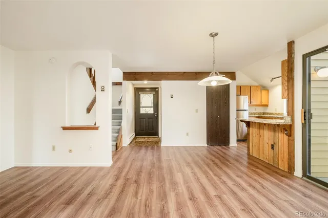 a view of a kitchen from the hallway