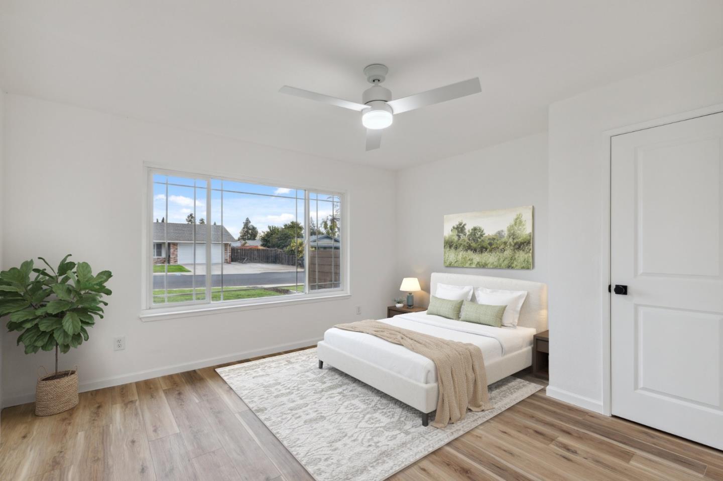 1413 Clevenger Drive Modesto, CA 95356 - Photo 20 of 37 a bedroom with a large bed and a window