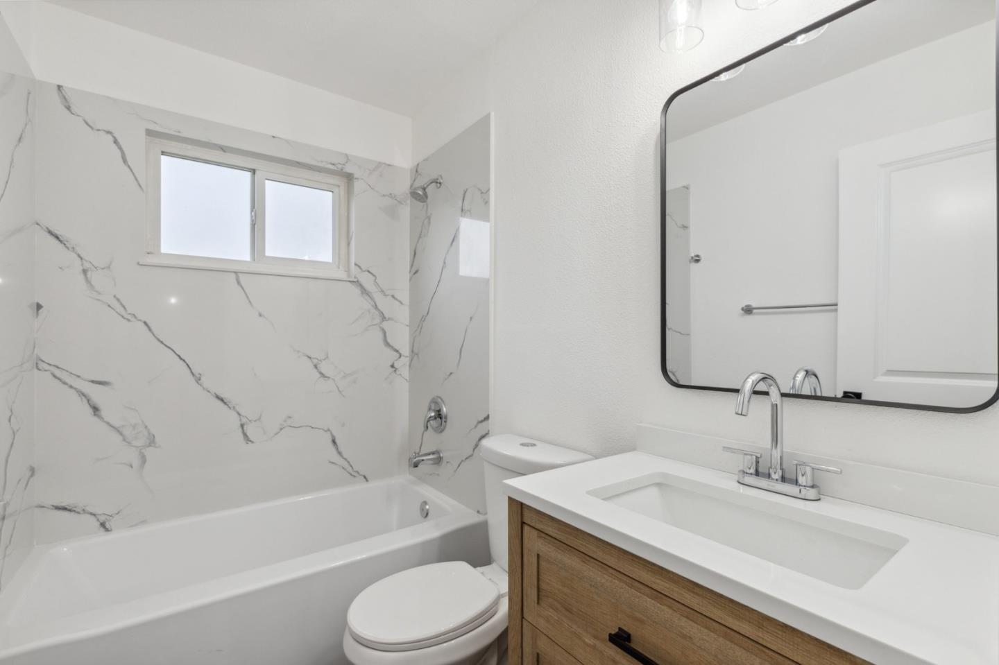 1413 Clevenger Drive Modesto, CA 95356 - Photo 26 of 37 a bathroom with a sink a toilet and a bathtub