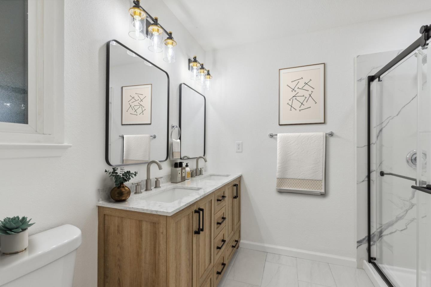 1413 Clevenger Drive Modesto, CA 95356 - Photo 28 of 37 a bathroom with double vanity sink and a mirror