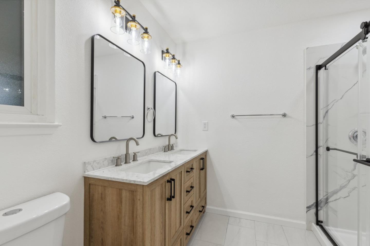 1413 Clevenger Drive Modesto, CA 95356 - Photo 29 of 37 a bathroom with a double vanity sink mirror and toilet
