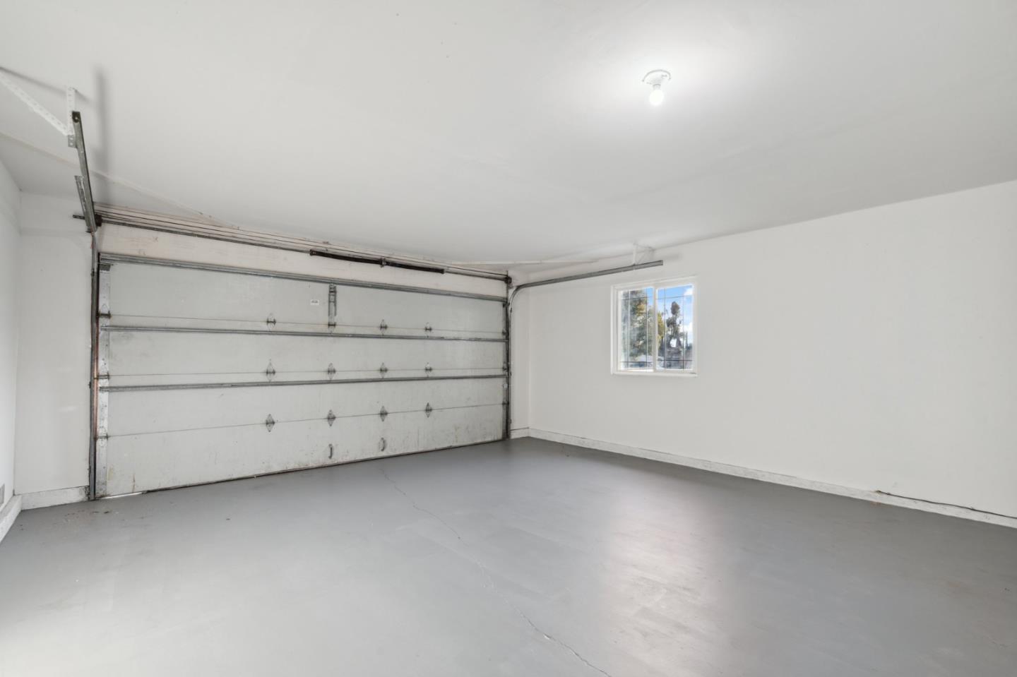 1413 Clevenger Drive Modesto, CA 95356 - Photo 31 of 37 an empty room with a empty space and windows