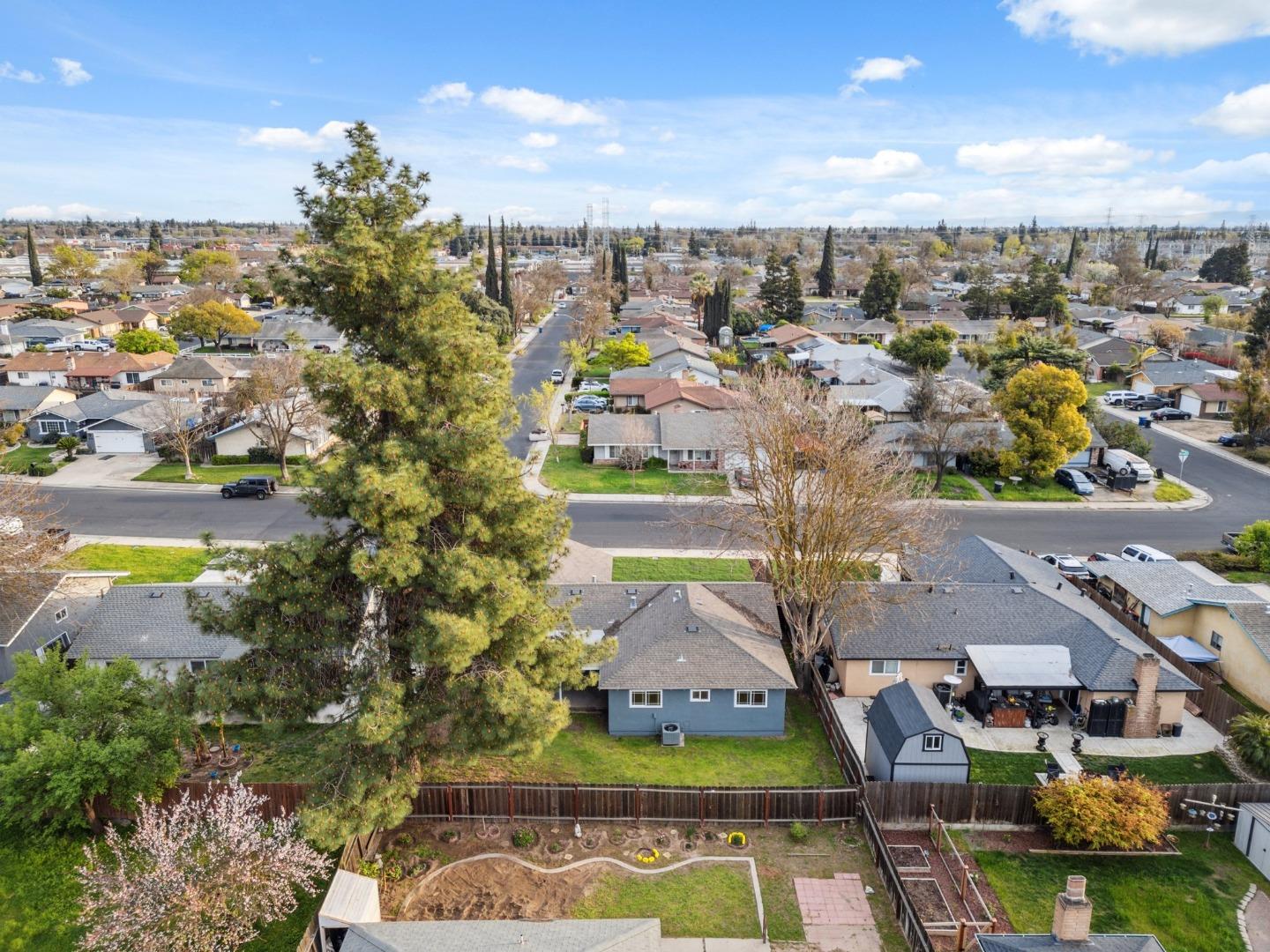 1413 Clevenger Drive Modesto, CA 95356 - Photo 34 of 37 an aerial view of a house with a garden