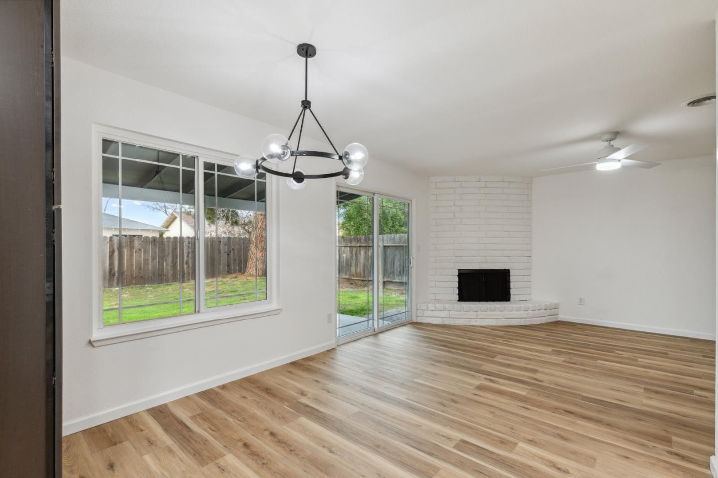 1413 Clevenger Drive Modesto, CA 95356 - Photo 6 of 37 a view of empty room with wooden floor and fan