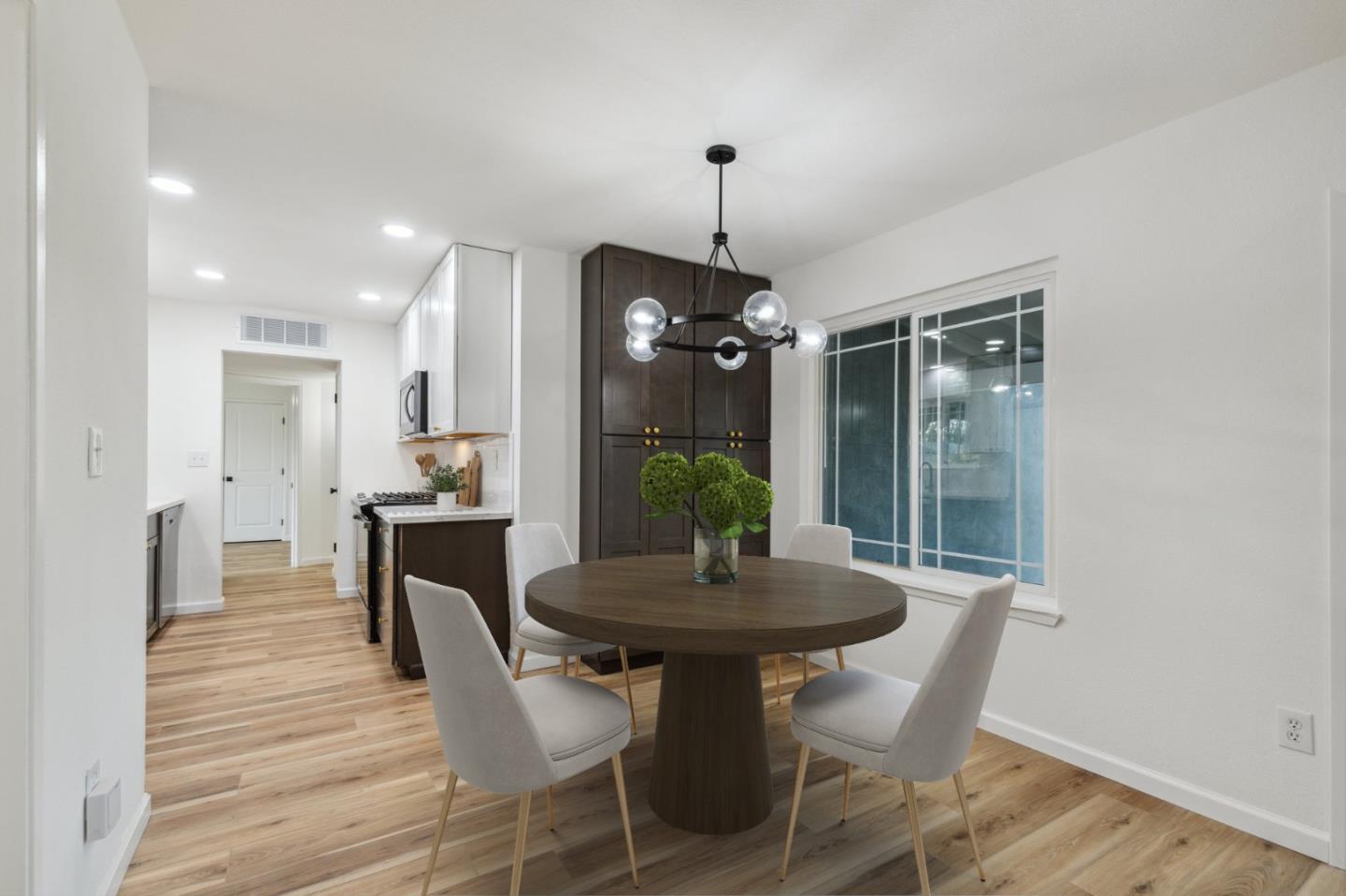 1413 Clevenger Drive Modesto, CA 95356 - Photo 7 of 37 a view of a dining room with furniture window and wooden floor