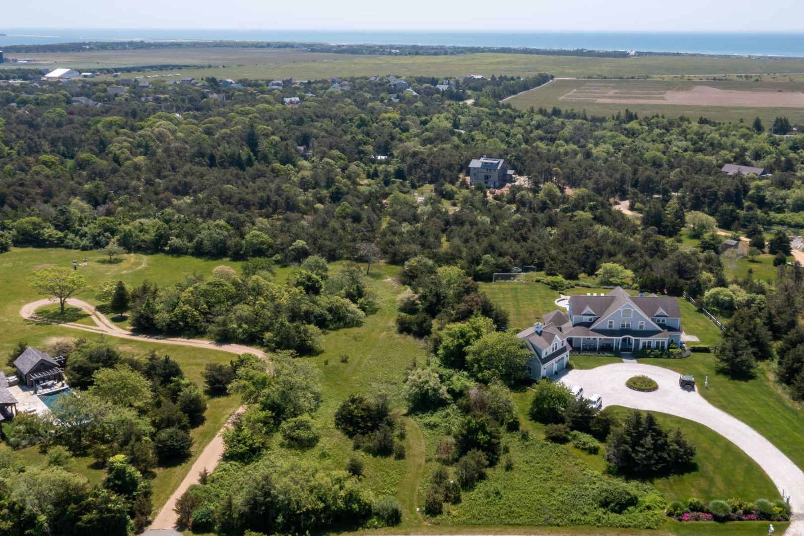 29 Slough Cove Road Edgartown, MA 02539 - Photo 4 of 8 an aerial view of a house with a garden
