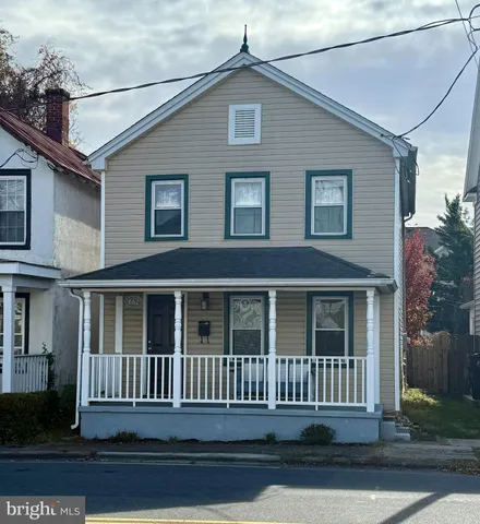a front view of a house with a porch