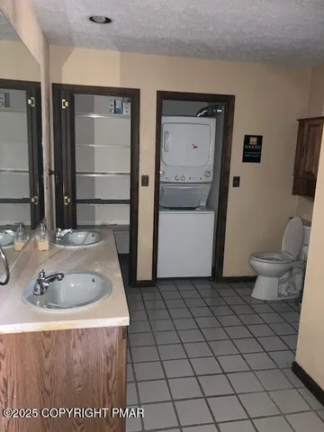 a bathroom with a sink toilet and mirror