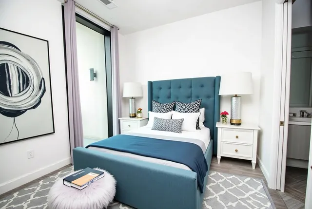 a bedroom with a bed and a couch