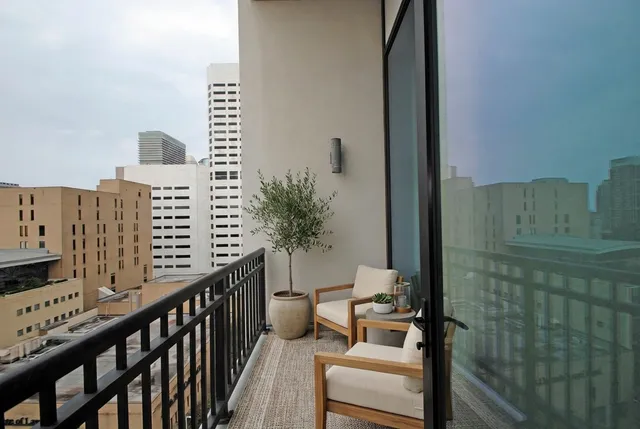 a view of balcony with a potted plant