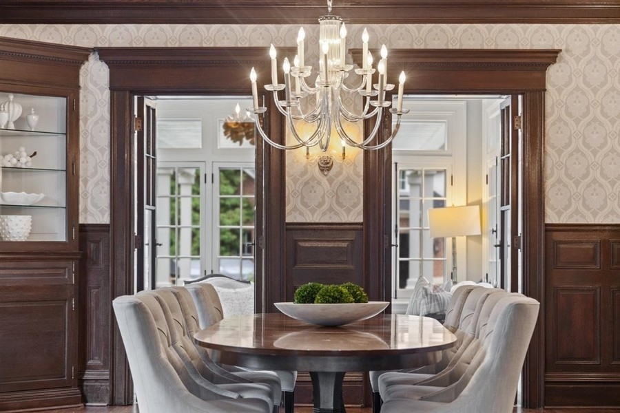 660 Prospect Avenue Winnetka, IL 60093 - Photo 15 of 77 a view of a dining room with furniture wooden floor and a chandelier