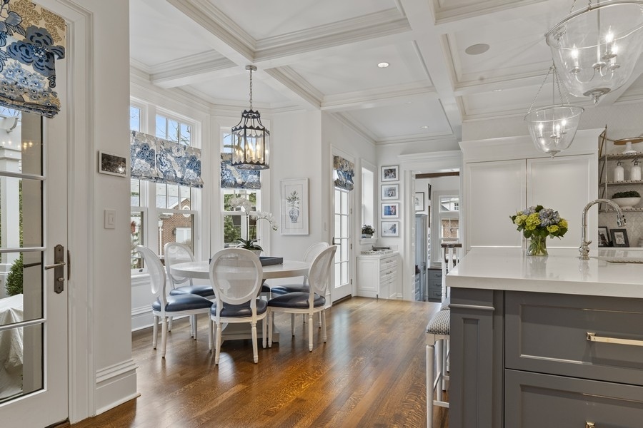 660 Prospect Avenue Winnetka, IL 60093 - Photo 22 of 77 a dining room with furniture and wooden floor