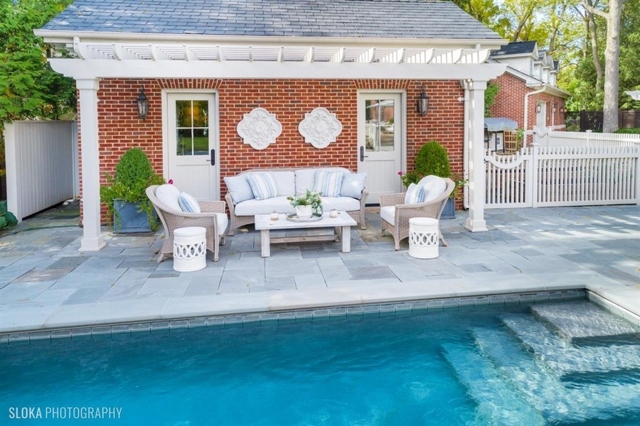 660 Prospect Avenue Winnetka, IL 60093 - Photo 29 of 77 a outdoor space with patio the couches and a dining table with garden view