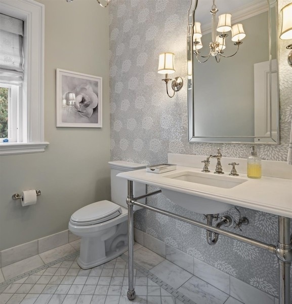 660 Prospect Avenue Winnetka, IL 60093 - Photo 41 of 77 a bathroom with a sink a toilet and a mirror