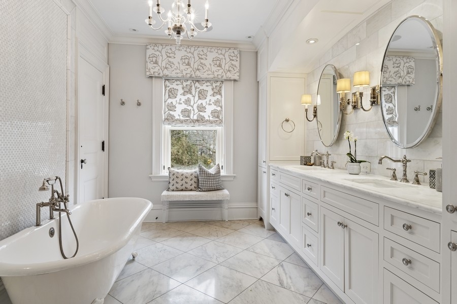 660 Prospect Avenue Winnetka, IL 60093 - Photo 46 of 77 a spacious bathroom with a double vanity sink double mirror and bathtub