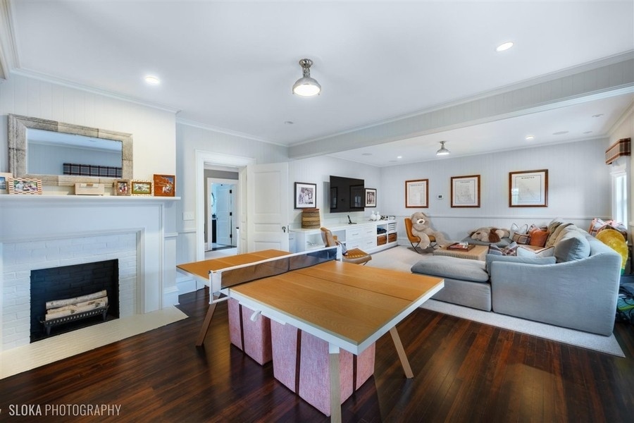 660 Prospect Avenue Winnetka, IL 60093 - Photo 56 of 77 a living room with furniture and a fireplace