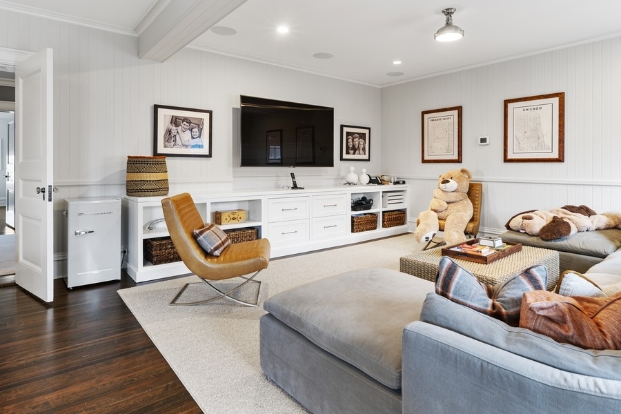 660 Prospect Avenue Winnetka, IL 60093 - Photo 58 of 77 a living room with furniture and a flat screen tv