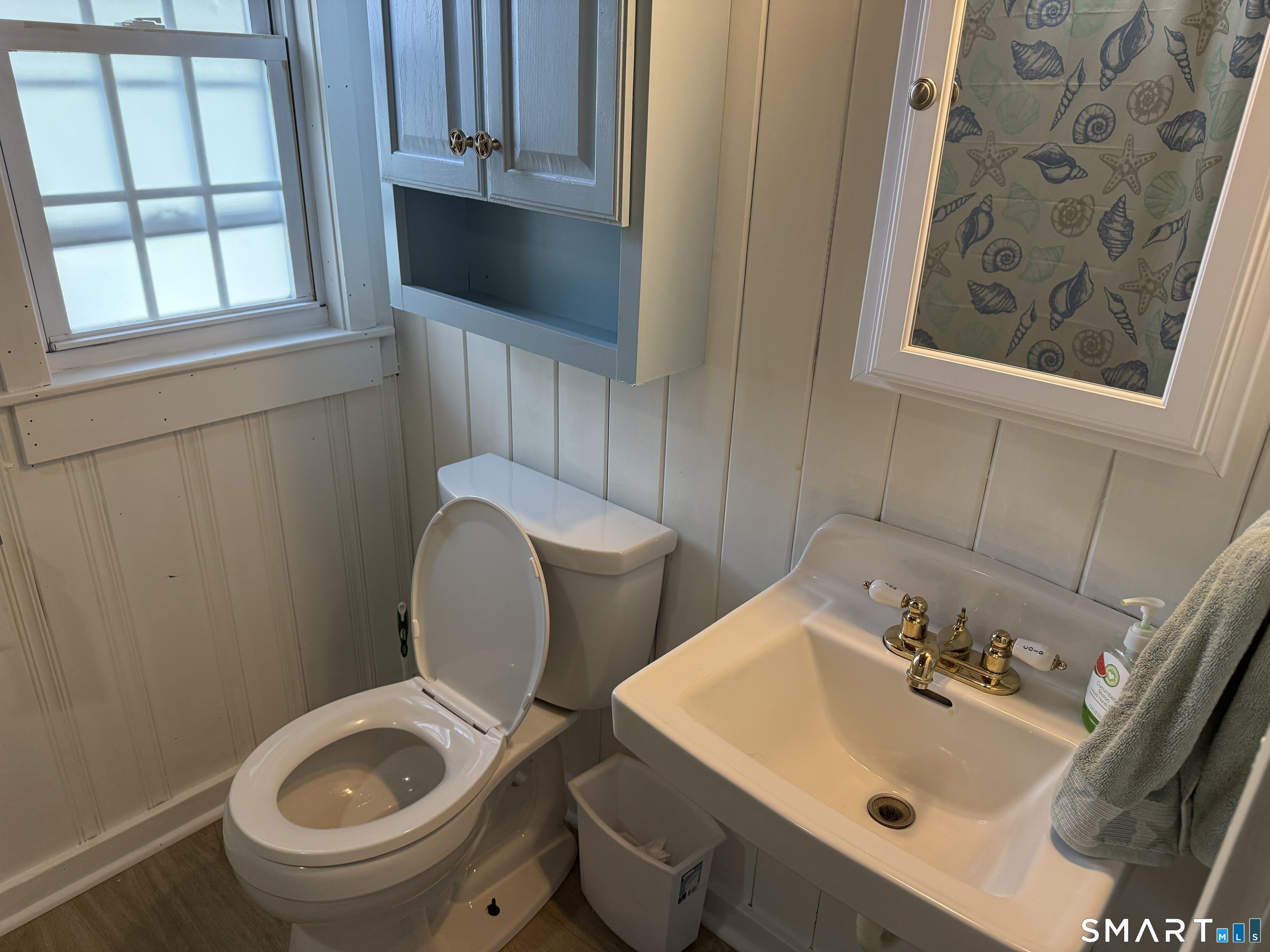 16 Springfield Road Old Lyme, CT 06371 - Photo 13 of 19 a bathroom with a sink and a toilet