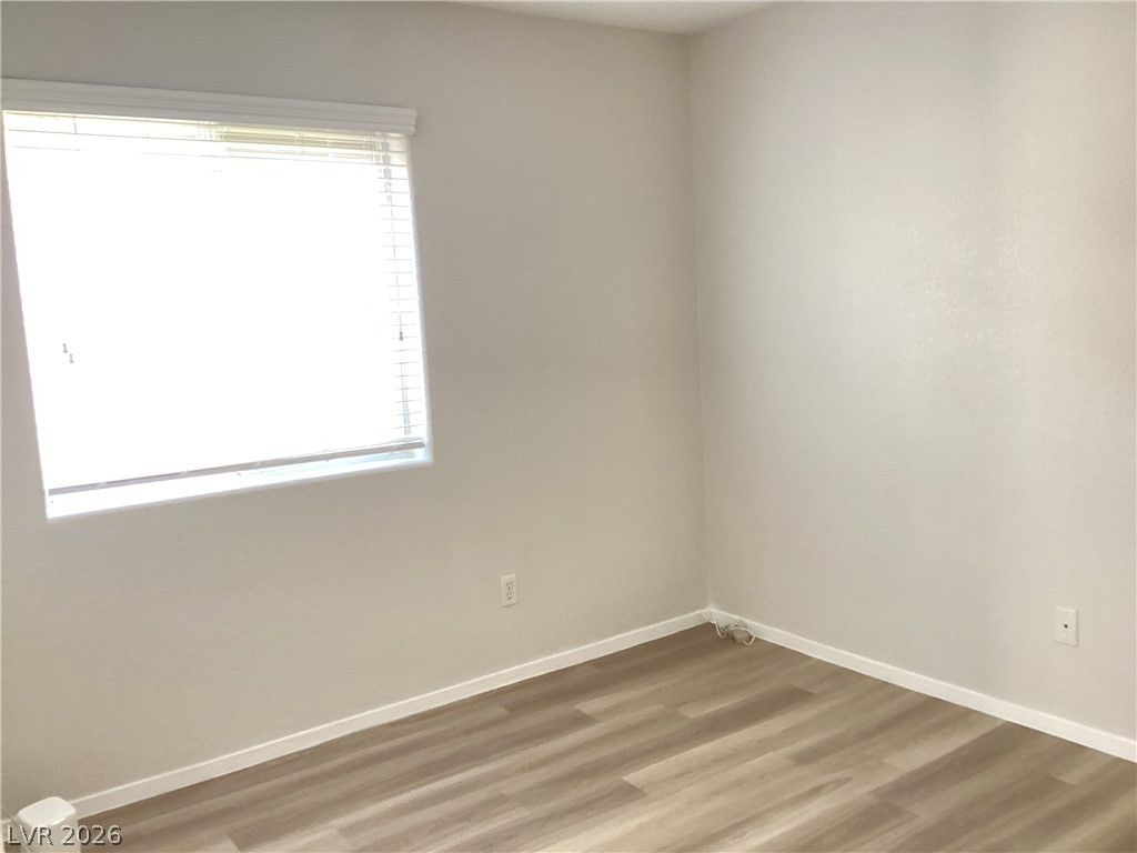 2135 Hidden Ranch Terrace Henderson, NV 89052 - Photo 17 of 27 Naturally illuminated, this well-proportioned room features modern flooring and a clean aesthetic.