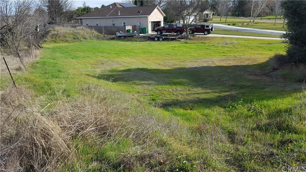 0 Eller Drive Corning, CA 96021 - Photo 3 of 6 a view of a house with a big yard and large trees